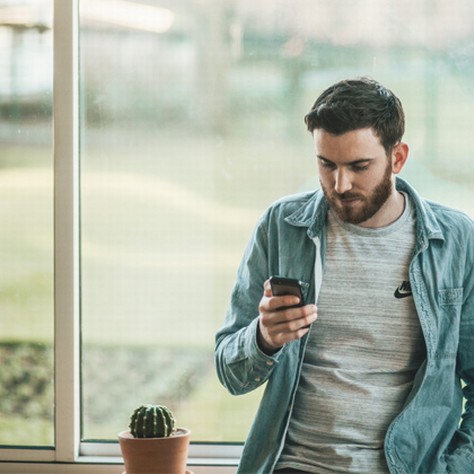 Man looking at his cellular