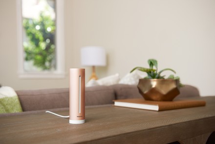 netatmo indoor air quality monitor on a desk